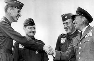Gen. Thomas Power (right), Commander In Chief of the Strategic Air Command, greets the B-58 Hustler crew that set three speed records and was later awarded the 1962 Mackay Trophy. From left are Maj. Robert Sowers and Capt's. Robert MacDonald and John Walton. For their record-setting flight, the crew flew roundtrip between New York and Los Angeles in four hours, 42 minutes.